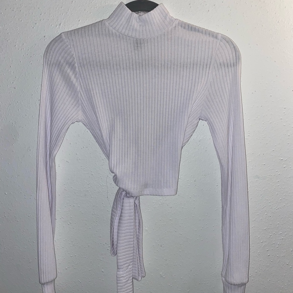 Cropped open back long sleeve turtle neck. Lightly used I’ve only worn once.
